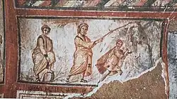 Moses striking the rock in the desert, a prototype of baptism[33]