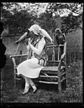 Mrs. Evans, with macaws from their private zoo