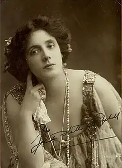 youngish white woman with dark hair posing for camera