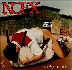 A man in the 69 position with a sheep.