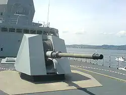 The OTO Breda 76&nbsp;mm gun. Note the low-RCS design of both the gun house and the exposed part of the barbette.