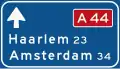 K1: Low level motorway information sign showing both main and intermediary destinations and the motorway number (old)