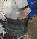Adding spices during black butter making