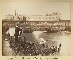 old boat in aqueduct over creek