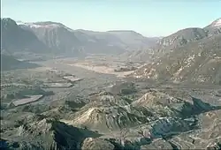North Fork Toutle River valley, filled with Mount St. Helens landslide debris and hummocks.