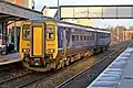 A Northern Rail Class 156 departs from the station.