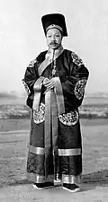 Third-rank Official at Yuan Shikai's visit to the sacrificial ceremony at the Temple of Heaven; he is wearing a robe with five roundels.