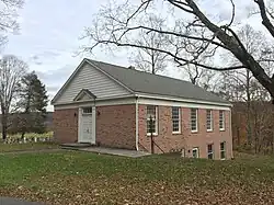 View of front and side elevations of a brick building
