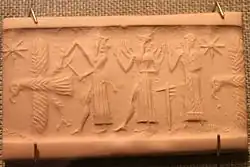 God with ax attacks eagle while Shamash and Worshipper stand behind