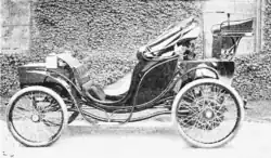 Columbia Victoria; this one seats the chauffeur high up behind passengers, although more typically, Victoria carriages mounted the driver's box in the front
