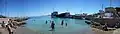 Panoramic image of the beach and harbor of Skala