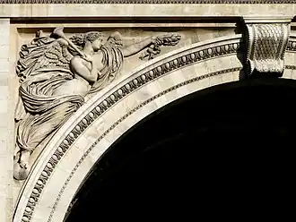 Figure of Pheme (Northern façade, left spandrel).