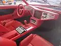 Interior view, showing the central screen and extensive use of red leather.