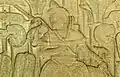 Bas-relief of a Khmer king carrying a phkak. Located at Angkor Wat (1100s)