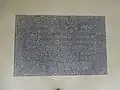 Floor sign at the entrance.