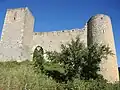 Walls, tower, and Gothic gate on via Camponeschi