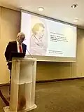 Hughes delivering lecture on Keats, RCP, London (2023)