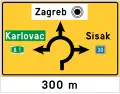 D03-2 Intersection signboard (in shape of an roundabout)