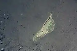 Providence Atoll in an image from space on 15&nbsp;April&nbsp;2001. Providence Island runs very close to north-south, which the image does not reflect.