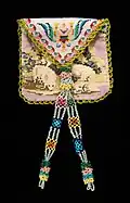 An early 19th-century Mexican handbag featuring a lamb and crown motif in traditional needlework and a silk dress lining.[35]