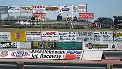 West bleachers, across the track.