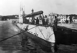 SM&nbsp;U-21 loads a torpedo during World War I.
