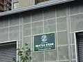 Sign on wood handling building on Western Avenue