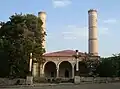 The mosque in 2010, with damaged minarets
