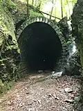 Slavošovský tunnel, freely accessible 2,4&nbsp;km long, never finished railway tunnel; Now a tourist attraction