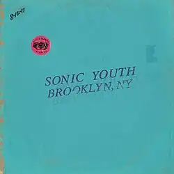 A teal cover with the album title stamped on it