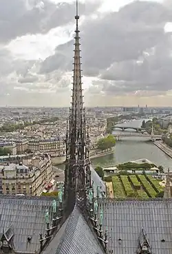 The 13th century flèche of Notre Dame, recreated in the 19th century, destroyed by fire in 2019, now restored