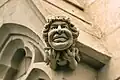 A carving of Queen Elizabeth II, depicted holding a corgi