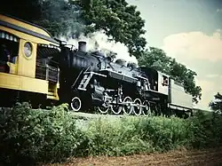 No. 90 pulling a tourist excursion tender-first, on July 19, 1984