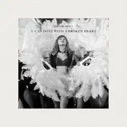 Black and white image of Taylor Swift performing "I Can Do It with a Broken Heart" on the Eras Tour, wearing a crop top, dress and jacket, with feathers on the sides.