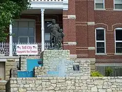 A statue of William Tell and his son Walter sits upon a fountain outside city hall. It is a famous city landmark.