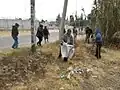 Mujeres haciendo el tequio limpiando calles. Tejupan, Oaxaca, México, 2018.