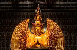 The wooden statue of thousand-armed and thousand-eyed Guanyin at the City of Ten Thousand Buddhas in Ukiah, California