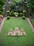 Castle and key set in the lawn of The Dell