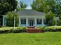 Located three miles east of Woodland, The Elms was built in 1838 and placed on the National Register of Historic Places. Robert H. Dixon, a Georgia State Senator and State Representative (1843) from Talbot County, owned this land from 1827 to 1857.