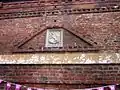 The Old King's Head. Mannerist brick decoration over earlier doorway