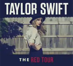 A photo of Swift in a white shirt, black shorts and hat looking backwards