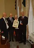 Eoghan Ganly, President of the Maritime Institute of Ireland (wearing chain of office) at Medal presentation to the grandchildren of Timoteo McCarthy, an Argentine national who served on a number of Irish ships in the war.