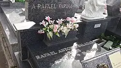 Grey and black grave stones with silver raised lettering