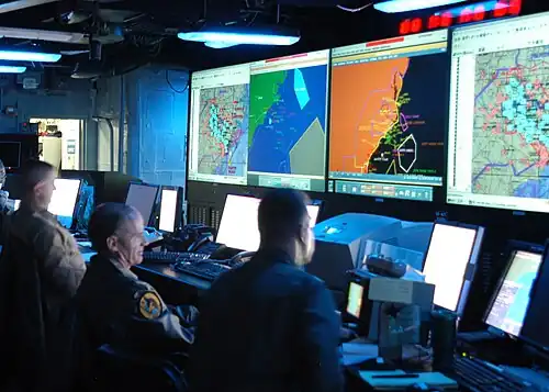Joint Operations Center watch standers aboard the command ship USS Mount Whitney in 2005
