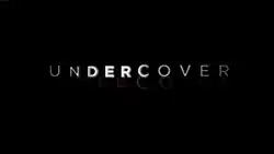 Series title reflecting against a black background