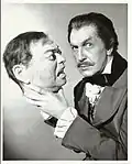 Vincent Price holding a replica of Lorre's head to publicize Tales of Terror, 1962