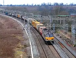 Image 3Freight train with shipping containers in the United Kingdom (from Transport)