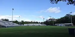 A soccer field surrounded by temporary seating.