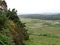 Knock of Luce ancient village fort. Rock face on steep northern slope