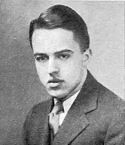 Photo portrait of a young man in a suit with a combed-back hairstyle
